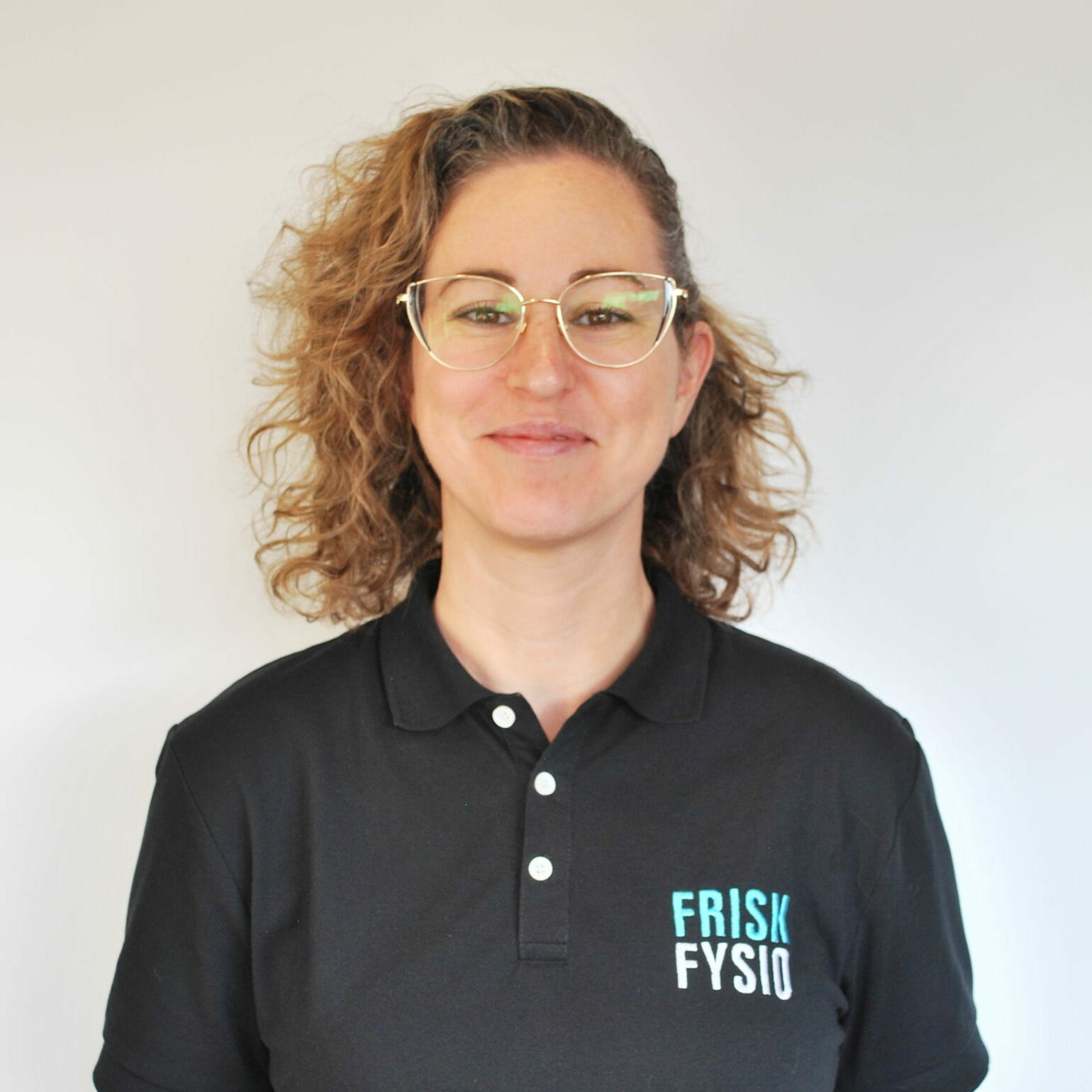 a woman wearing glasses and a black shirt